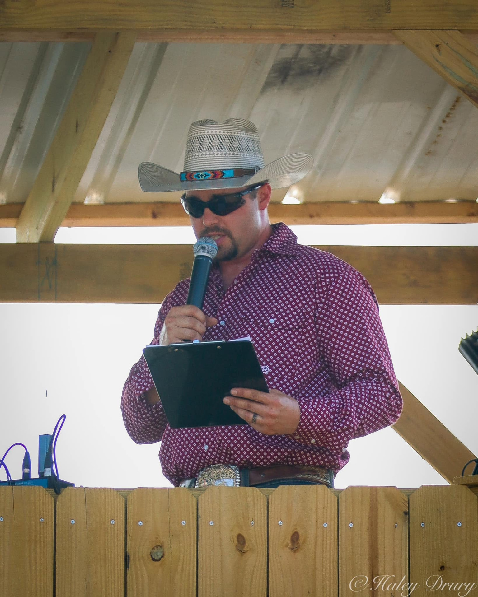 Tyler Pence calling a sale from the auction booth